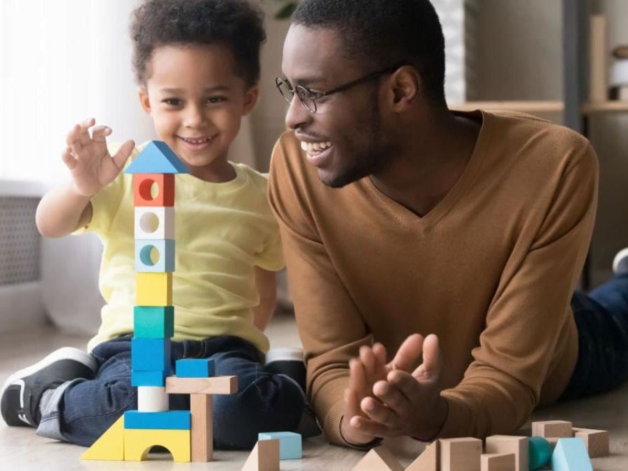 Father and son playing with blocks